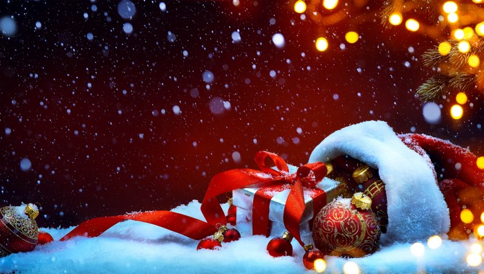 Christmas gifts and ornaments in snow