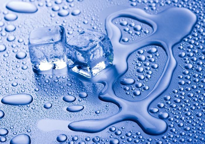 Ice cubes melting on a wet surface