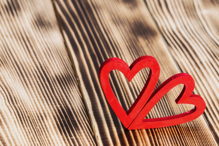 Two red hearts on wood planks