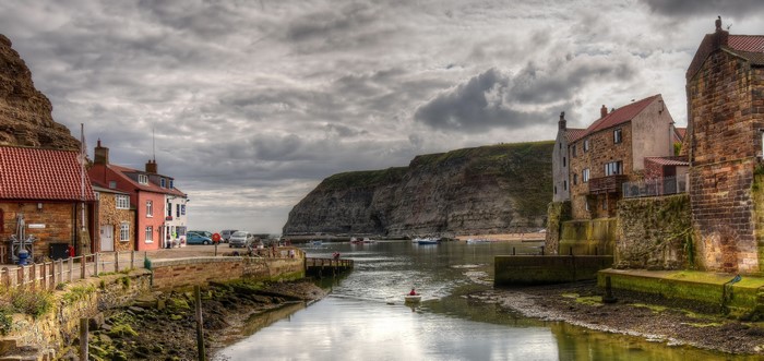 Staithes, England harbor with houses and cliffs