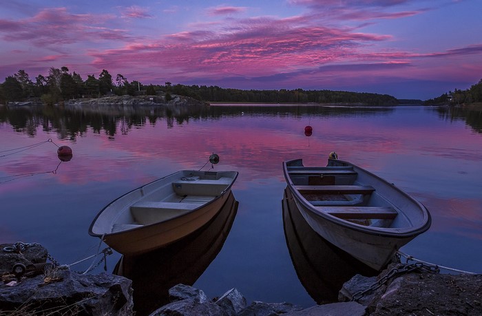 Two boats on a lake at sunset in Sweden
