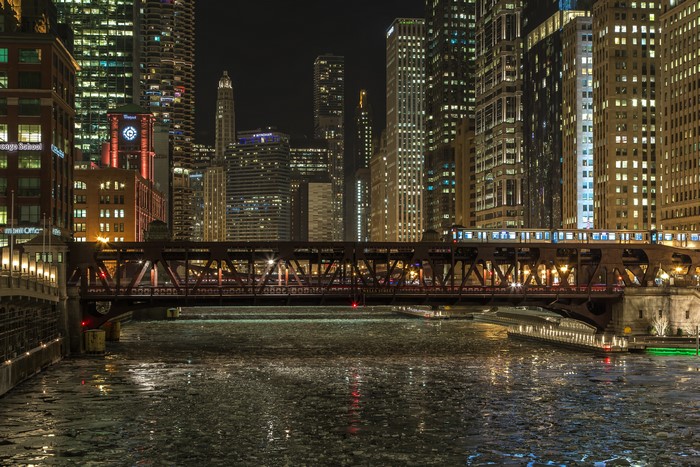 Chicago city at night with a bridge and river