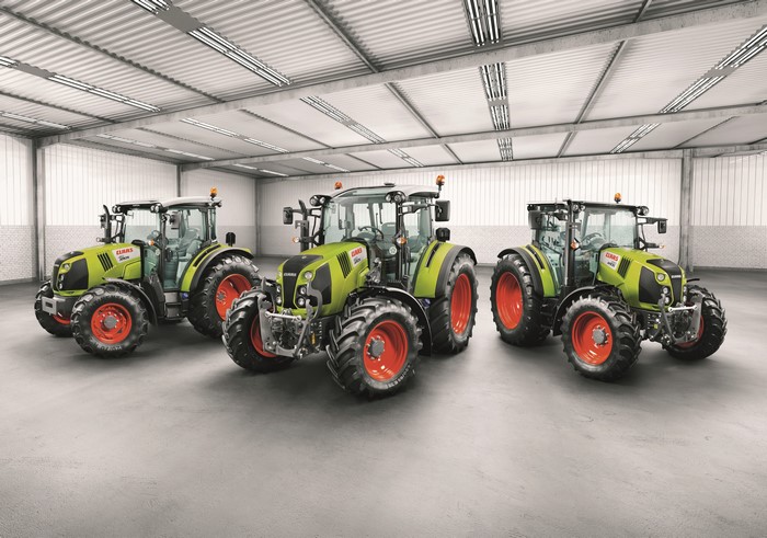 Three 2014-17 Claas Arion 410 tractors in a warehouse