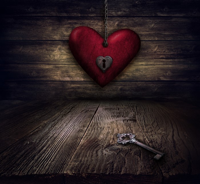 Heart with Lock and Key on Wood