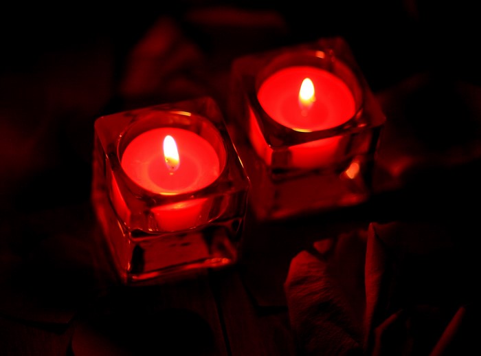 Two red candles in glass holders