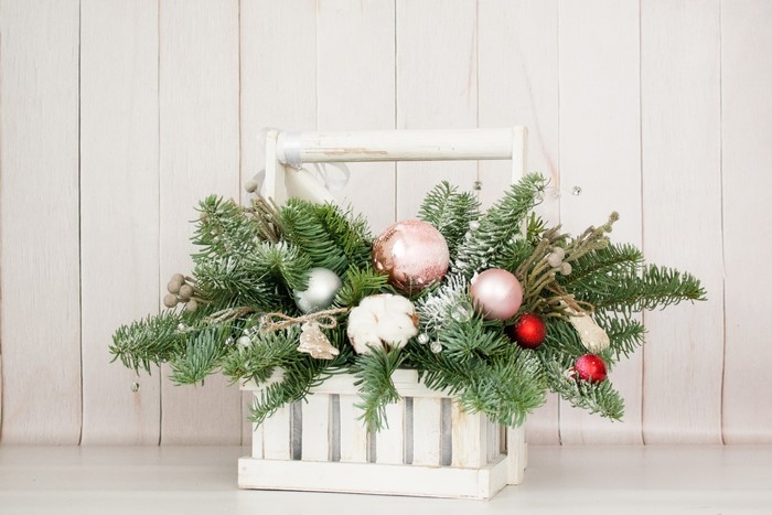 Christmas floral arrangement in a wooden basket