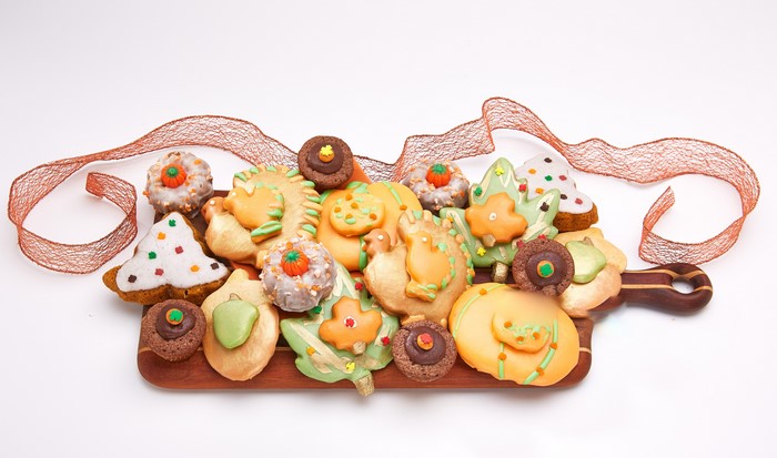 Assortment of Fall-themed Cookies on a Cutting Board with Ribbon