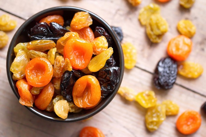Bowl of dried apricots, raisins, and prunes