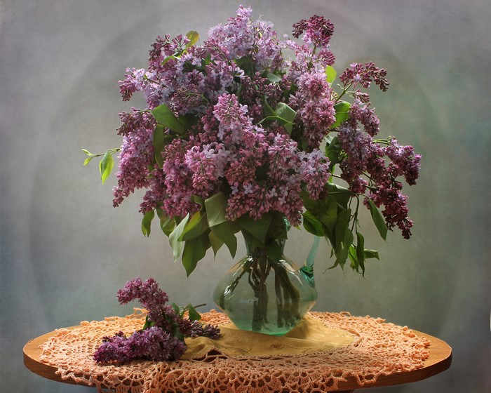 Bouquet of lilacs in a vase on a table