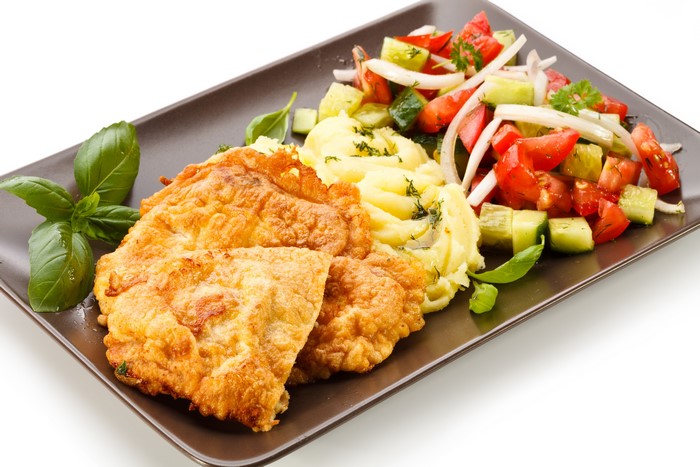 Fried cutlets with mashed potatoes and salad