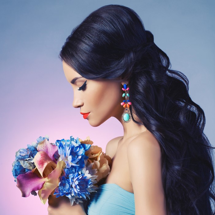 Brunette girl with bouquet and earrings
