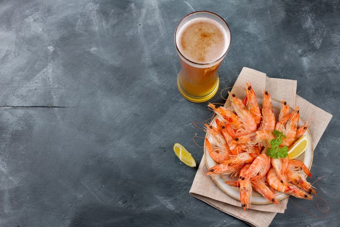Shrimp and Beer on Gray Background