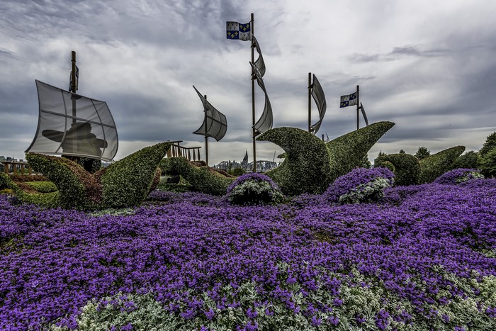 Topiary ships and flags in a garden
