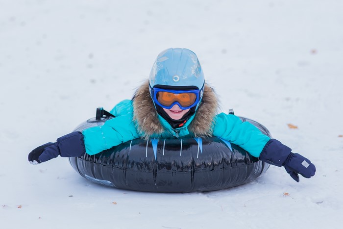 Boy in Winter Gear Tubing