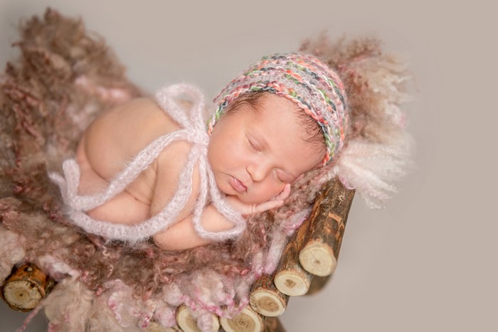 Newborn baby sleeping in a basket