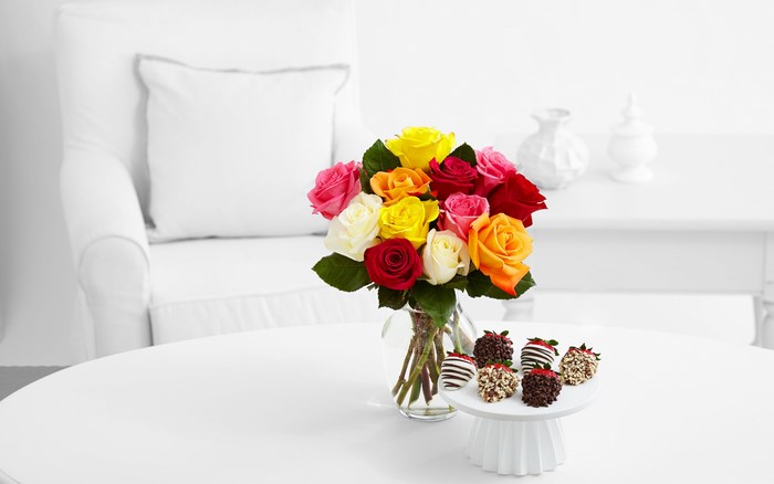 Roses and Chocolate Covered Strawberries on a Table