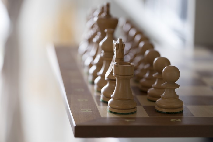 Wooden Chess Pieces on a Chessboard