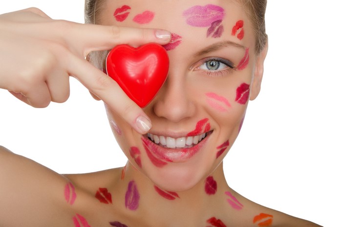 Woman with lipstick kisses and heart shape