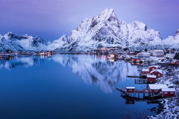 Winter Evening in Reine, Norway with Snow-Capped Mountains and Lake