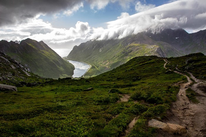 Mountain valley with a lake and a hiking trail in Lofoten, Norway