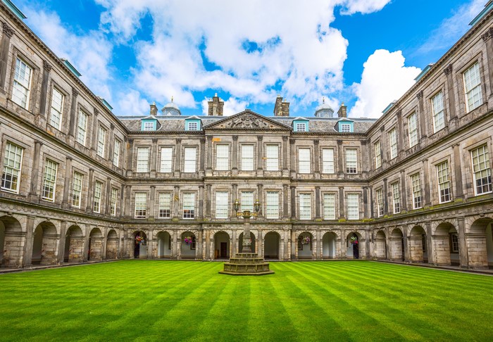 Holyroodhouse Palace courtyard with fountain and lawn