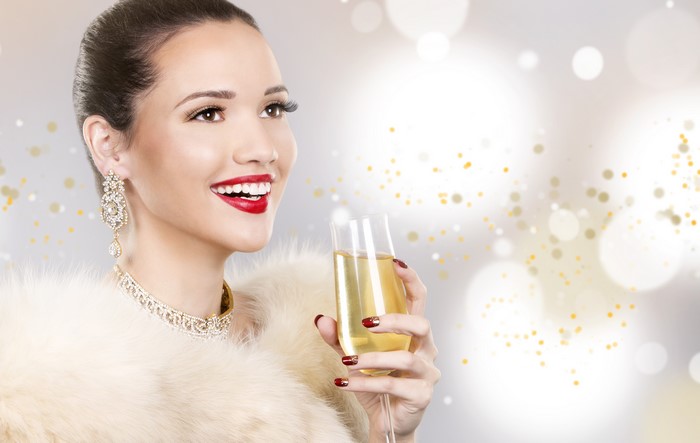 Woman in Jewelry Holding Champagne