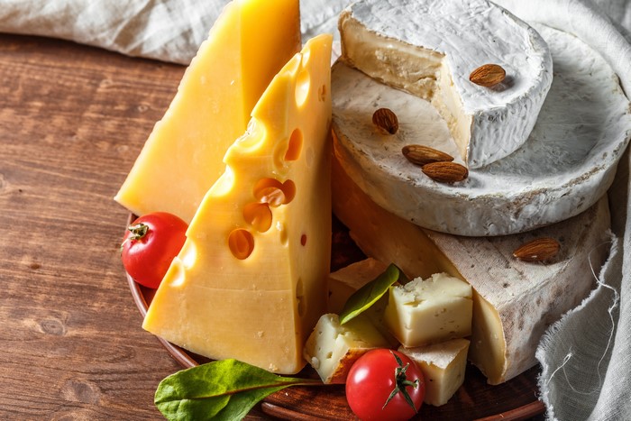 Assortment of Cheeses with Nuts and Tomatoes