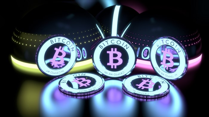 Bitcoin coins with glowing spheres