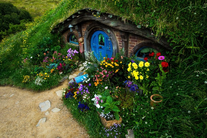 Hobbiton Hobbit Hole House with Blue Door and Flowers