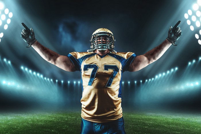 American football player with number 77 uniform