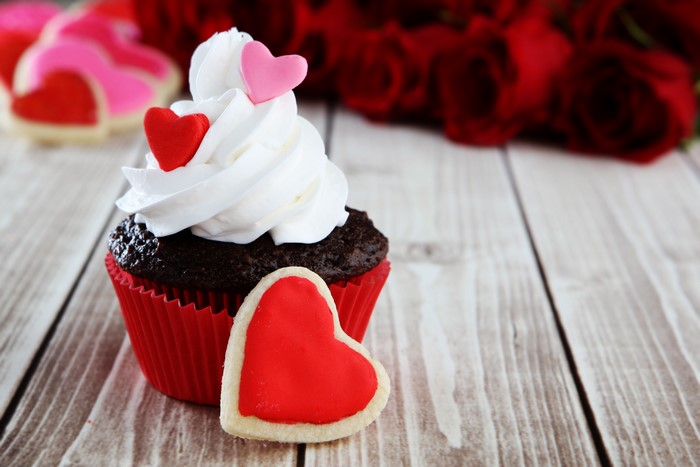 Valentine's Day cupcake with heart cookies and roses