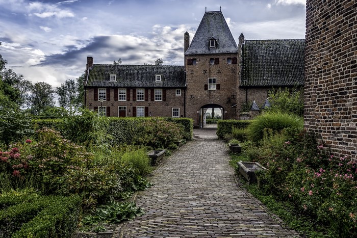 Castle Doorwerth, Netherlands, with cobblestone path and garden