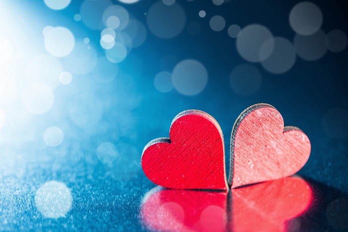 Two red hearts on a blue background
