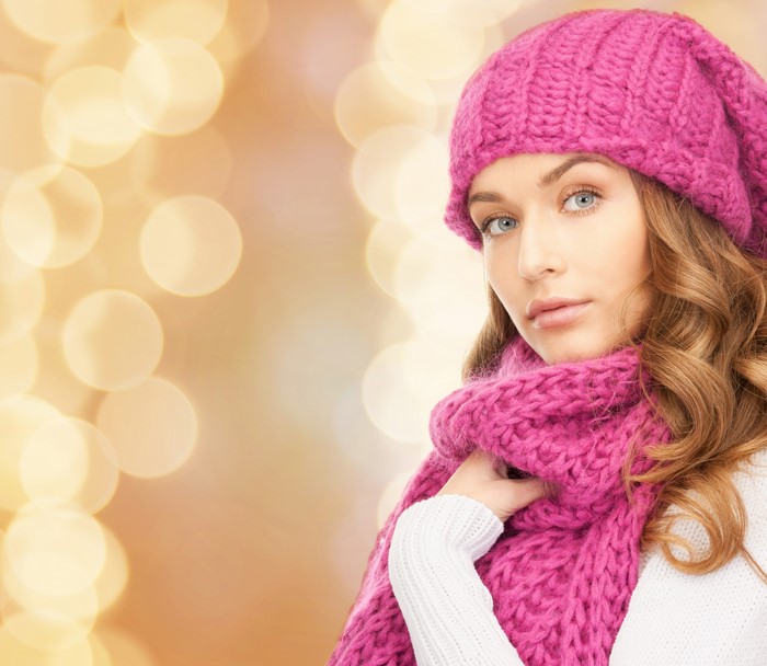 Woman in pink winter hat and scarf