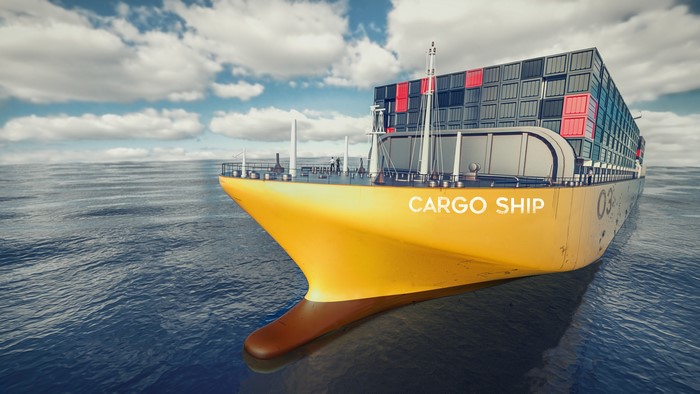 Yellow cargo ship sailing on the ocean