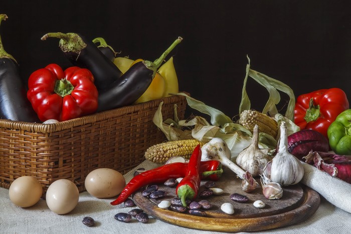 Still life with vegetables, eggs, and corn