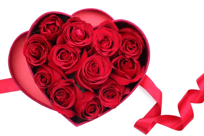 Heart-shaped box of red roses with ribbon