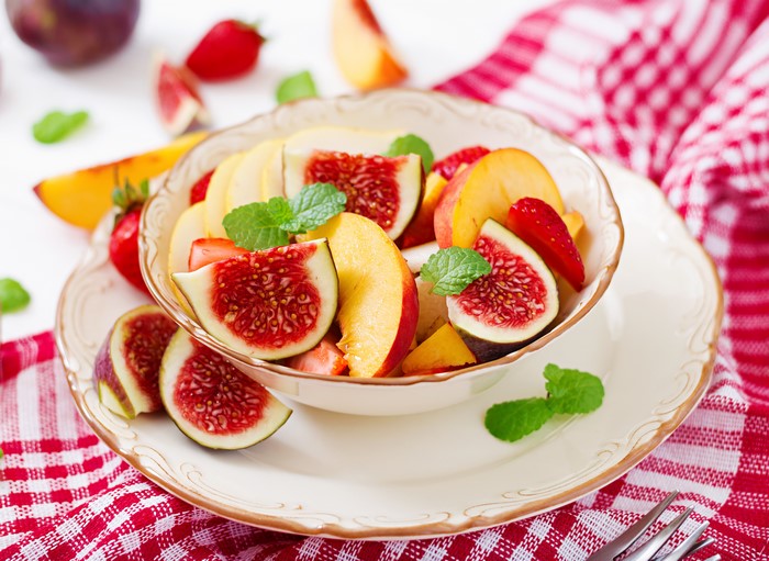 Fruit salad with figs, peaches, and strawberries