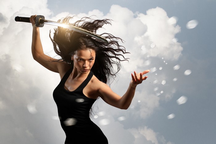 Woman with Katana in front of cloudy sky