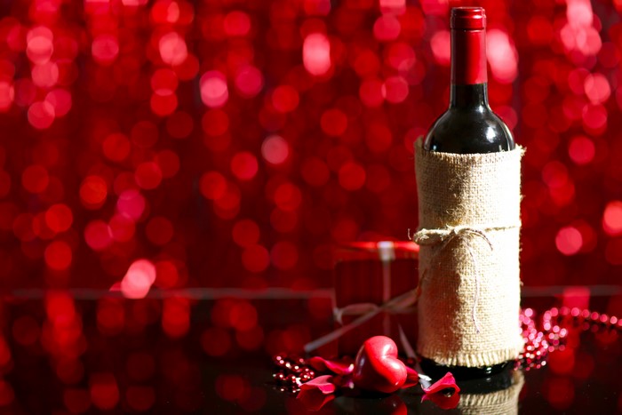 Wine bottle with burlap wrap and Valentine's Day decorations