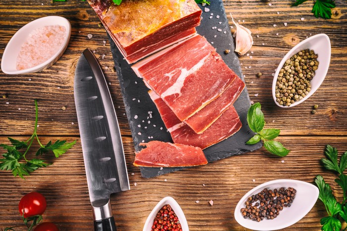 Sliced Cured Meat with Spices and Knife