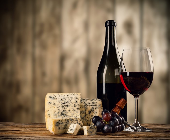 Still-life of wine, cheese, and grapes