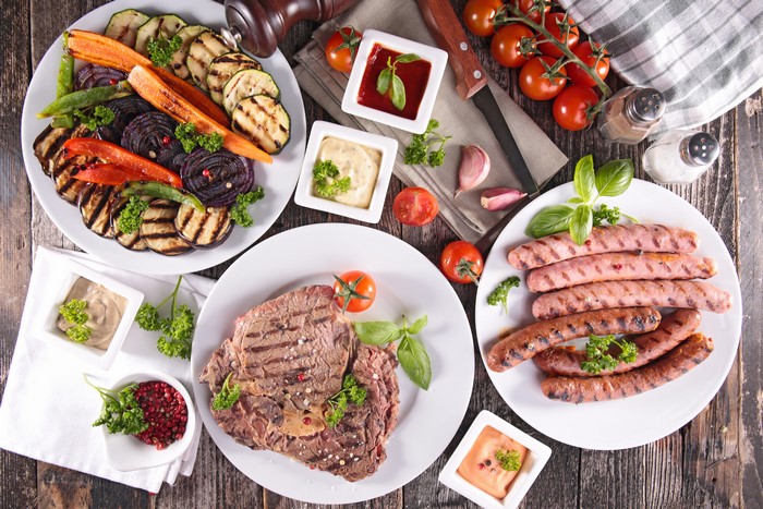 Grilled Steak, Sausages, and Vegetables with Dips