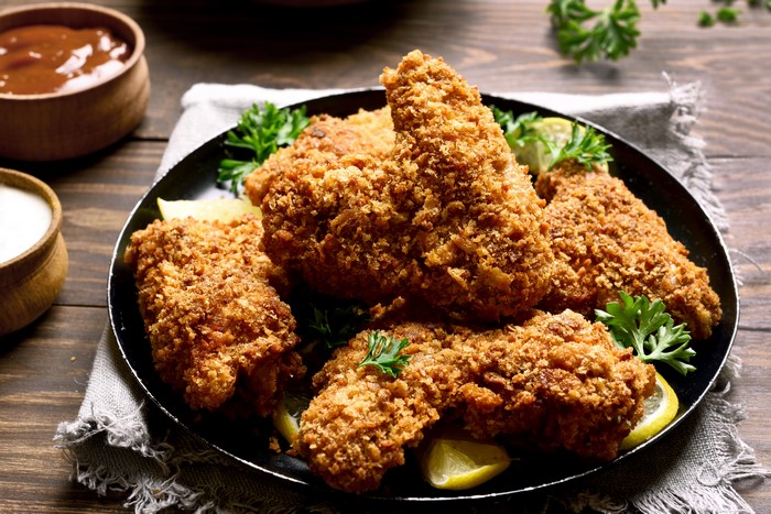 Crispy fried chicken with lemon and parsley