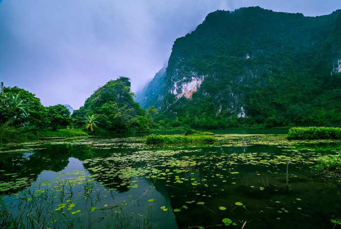 Misty mountains and a tranquil lake in Vietnam