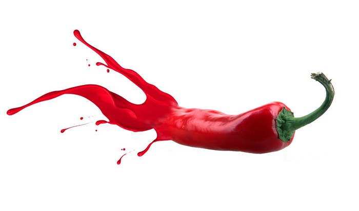 Red chili pepper with red paint splash