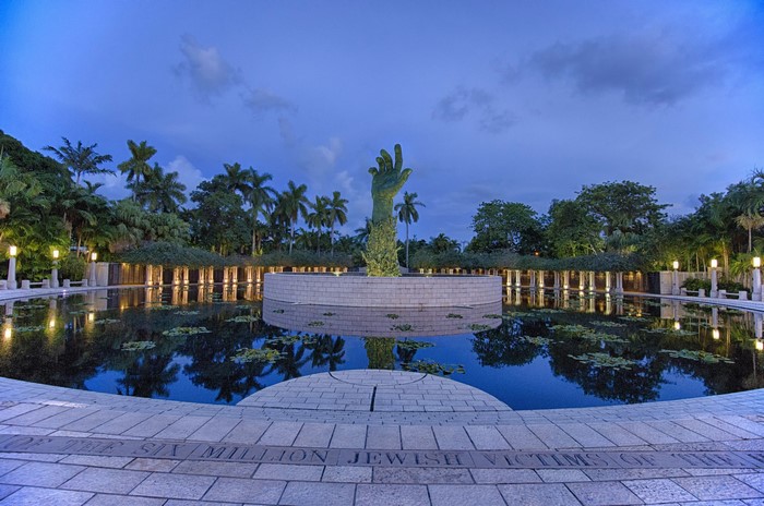 Holocaust Memorial with Hand Sculpture and Pond in Florida