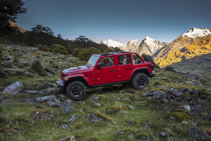 Red Jeep Wrangler Unlimited Rubicon on rocky terrain