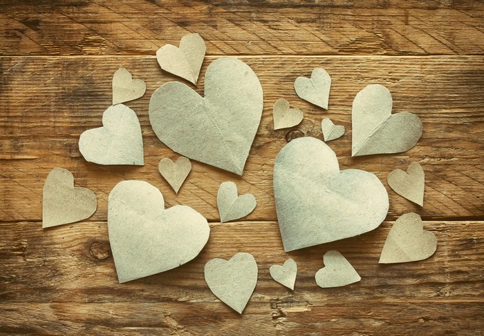 Paper hearts on wooden planks