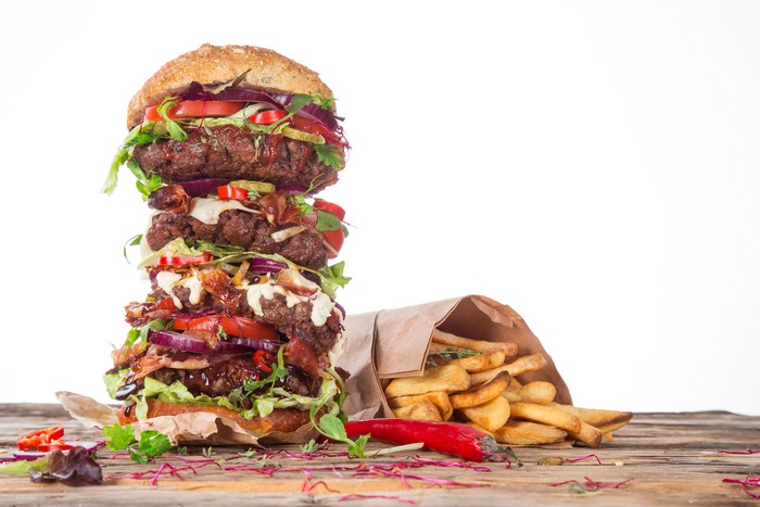 Giant triple-decker hamburger with french fries